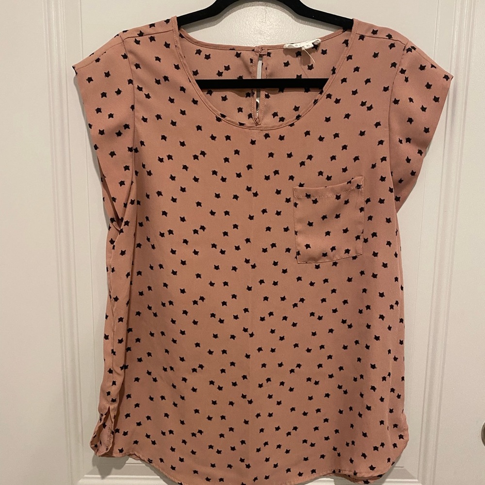 Pink blouse with black cats.